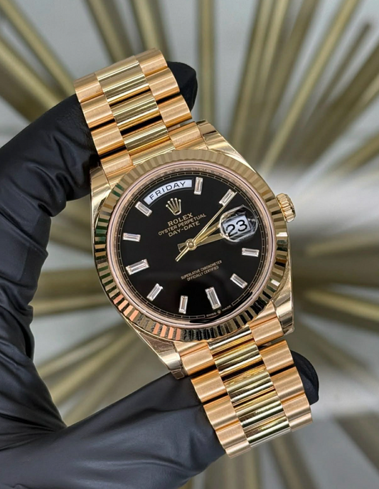 2026 Rolex Day Date Yellow Gold Black Baguette Dial 228238